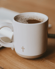 Speckled ceramic coffee mug with subtle cross detail, perfect for prayer, journaling, and morning devotionals