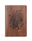 Aurora Christian notebook journal with floral design embossed on warm brown leather-like cover for prayer journaling, Scripture reflection, and daily devotion