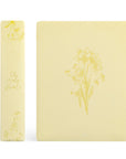 Belfast NLT journaling Bible showing spine and soft butter yellow daffodil cover design
