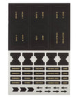Set of black and gold sticker index tabs with blanks and symbols.