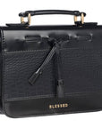 Angled view of Blessed black croc faux leather Bible cover showing black tassels, blessed, and handle