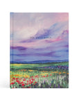 Cana NLT journaling Bible in purple and blue landscape design and wildflowers on hardcover with the text "The Holy Bible"