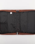 Interior of Faith honey brown faux leather Bible cover showing open case with pen loops, zippered mesh pocket, and protective lining for organizing Christian Bible and accessories