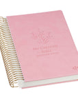 Angled view of pink faux leather My Creative Bible Illustrators Edition KJV spiral bound journaling Bible