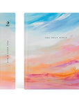 Spine and front cover of Rosemary Beach NLT journaling Bible with colorful sunrise sky design