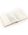 Blush pink Shiloh notetaking Bible angled view showing spine and soft leather-like cover