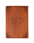 Vienna Christian notebook journal back cover with John 1:16 Scripture engraved on warm brown leather-like cover for prayer journaling and faith reflection