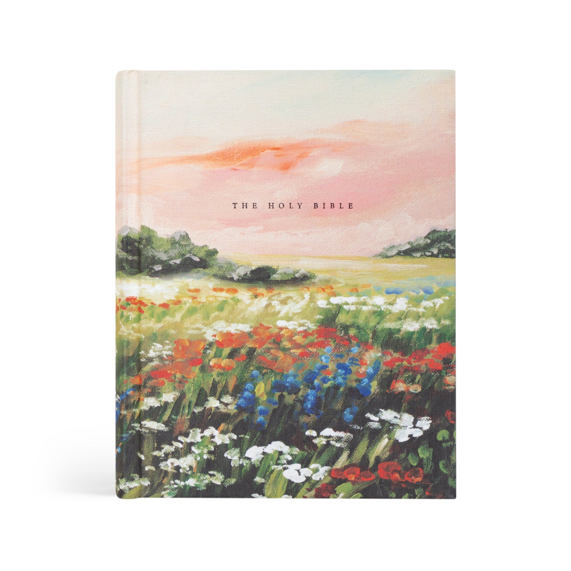 The image displays the Coram Deo NLT Notetaking Bible with a cloth-over-board hardcover featuring a floral design. The title 'THE HOLY BIBLE' is embossed on the cover.