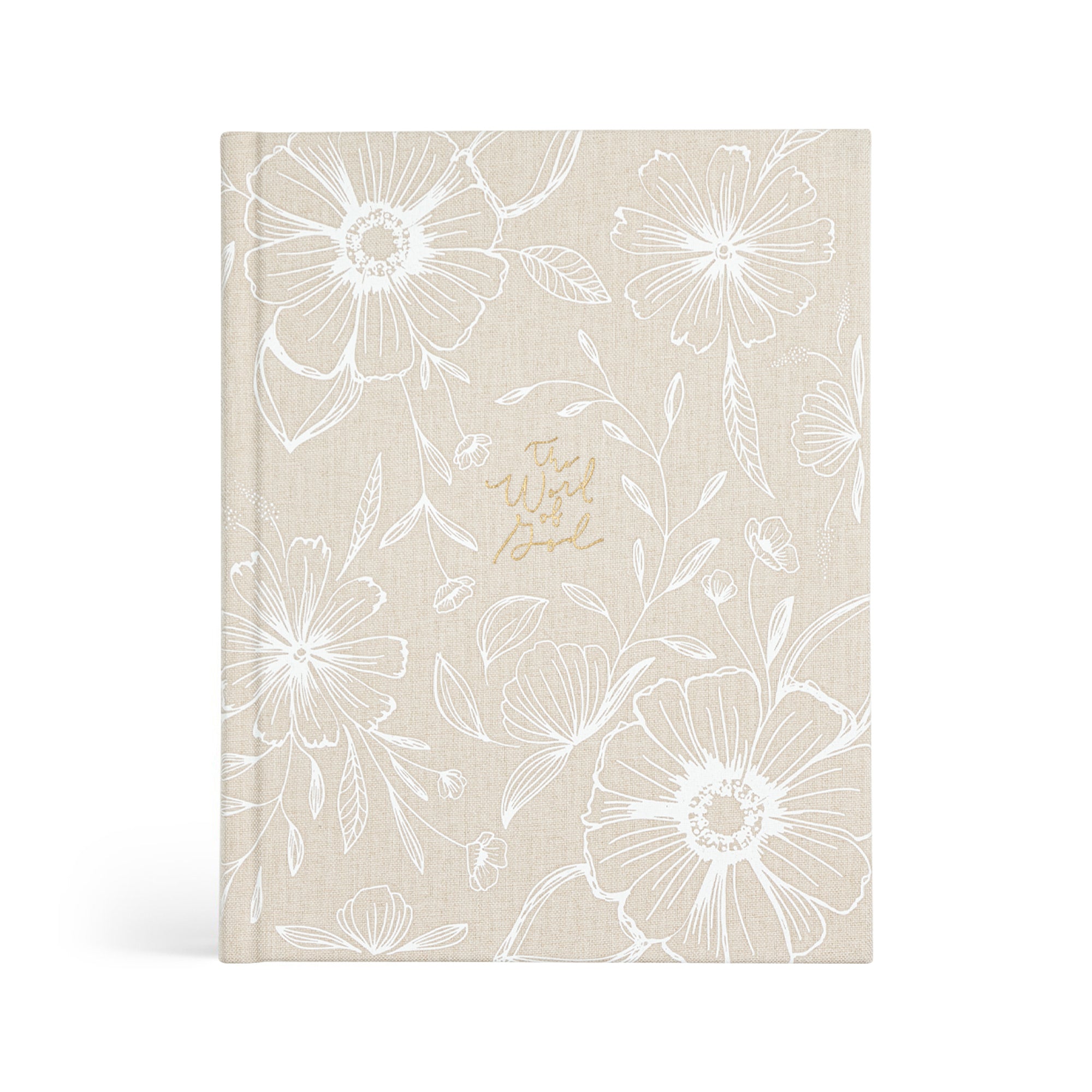 A hardcover journaling Bible with a beige background and floral designs, titled 'The Word of God' on the front cover.