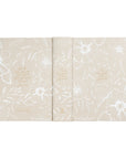 Cordova themed NLT Journaling bible is laid flat to view the front, back and spine. It is hard cover with floral canvas. 