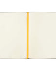 Florence Christian notebook open to lined pages with cream paper and yellow ribbon bookmark for journaling and notes