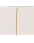 Open Jerusalem journal showing lined interior pages with a gold ribbon bookmark.