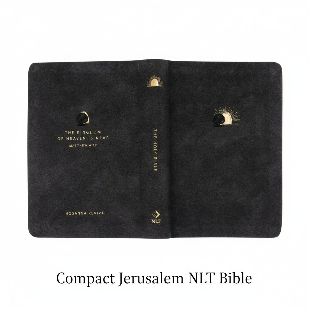 Black NLT Compact Jerusalem Bible with gold text and design laid  flat. 