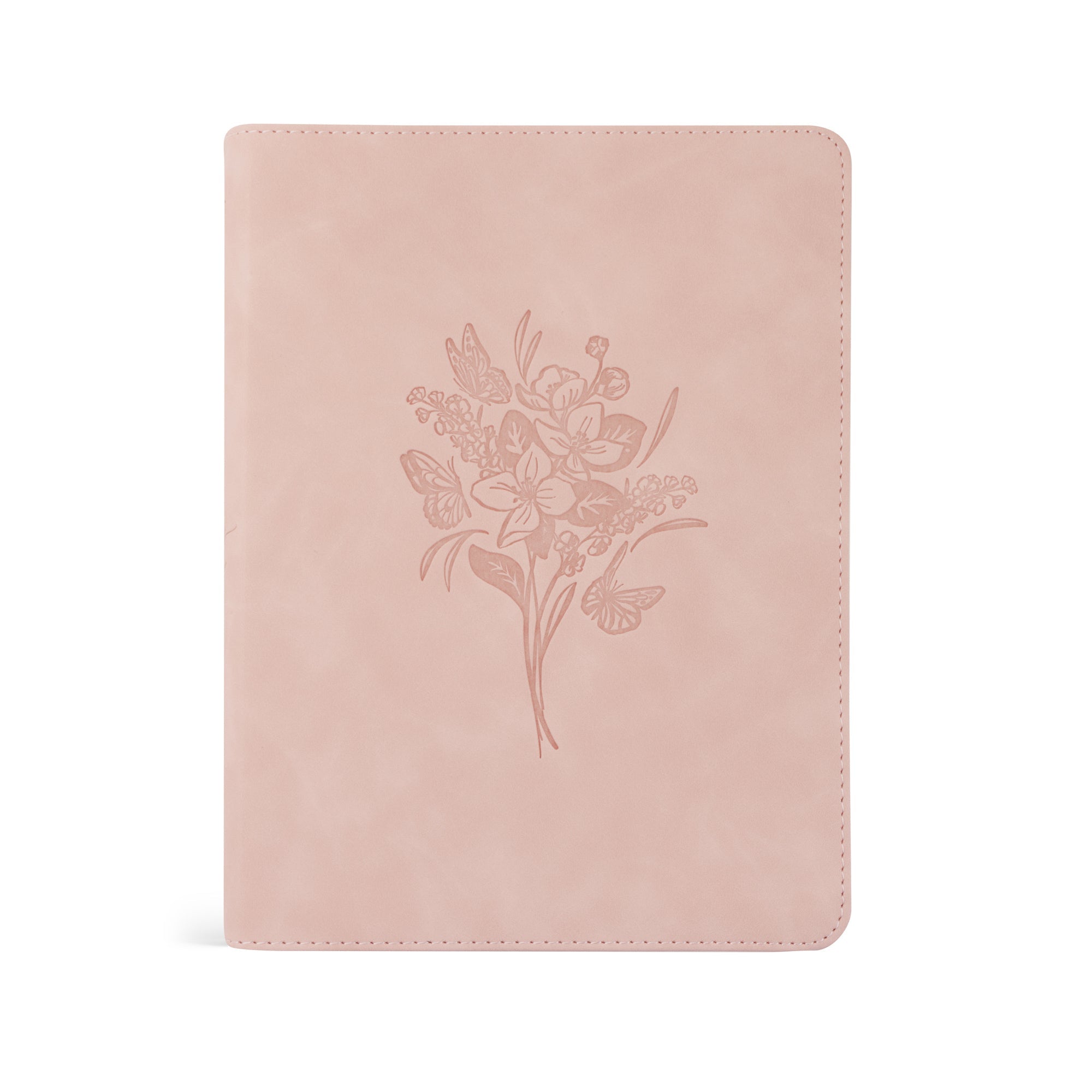 A blush pink suede ESV journaling Bible with a floral design embossed on the cover.