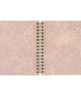 Pink notebook planner with floral pattern and gold text. Front and back cover laid out. 