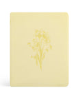 Belfast NLT journaling Bible with soft butter yellow cover and embossed daffodil design