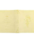 Belfast NLT journaling Bible full wrap showing front, spine, and back butter yellow daffodil design