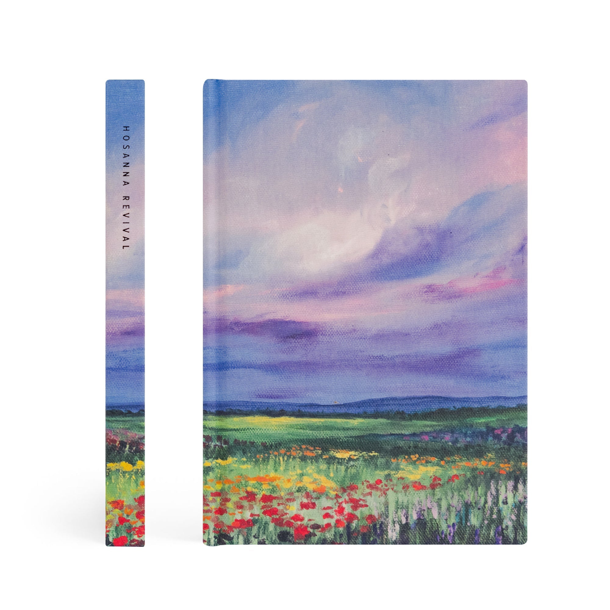 Cana Christian notebook showing spine and front cover with purple and blue landscape design and colorful wildflowers