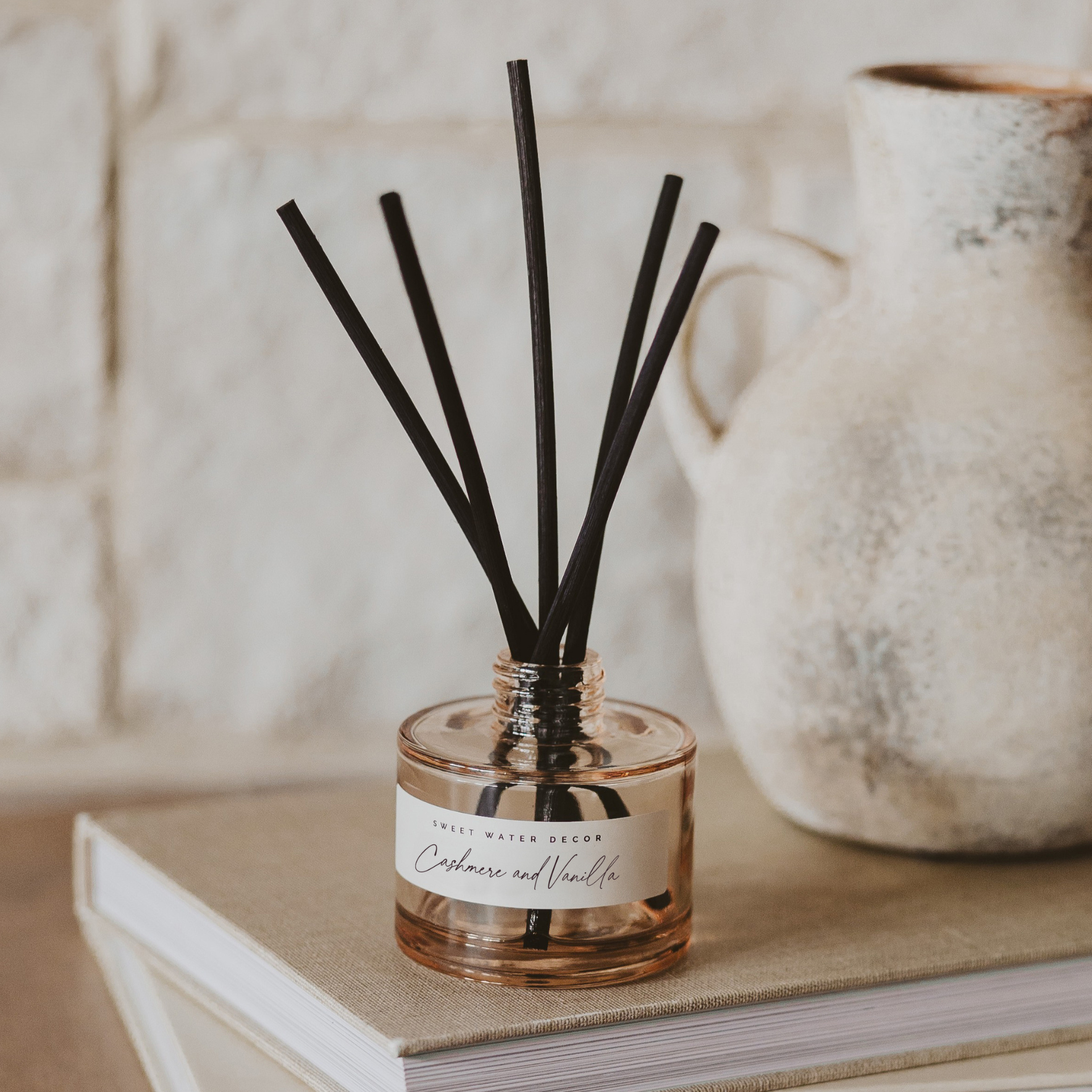 Elegant Cashmere and Vanilla Reed Diffuser adding cozy home fragrance to modern living room décor