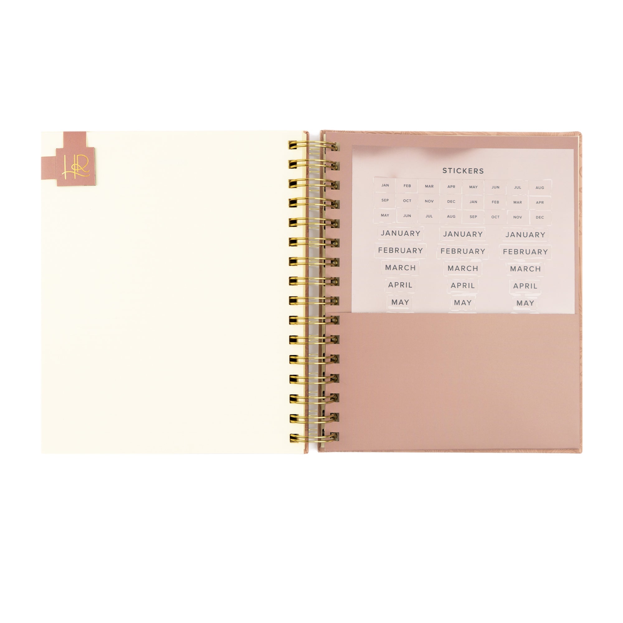 Spiral undated Christian planner with stickers to organize the months. 