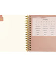 Spiral undated Christian planner with stickers to organize the months. 