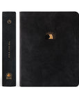Front cover and spine of the CSB Jerusalem Bible by Hosanna Revival, featuring black suede, gold-foil sunrise and tomb artwork, and ‘The Holy Bible’ lettering on the spine.