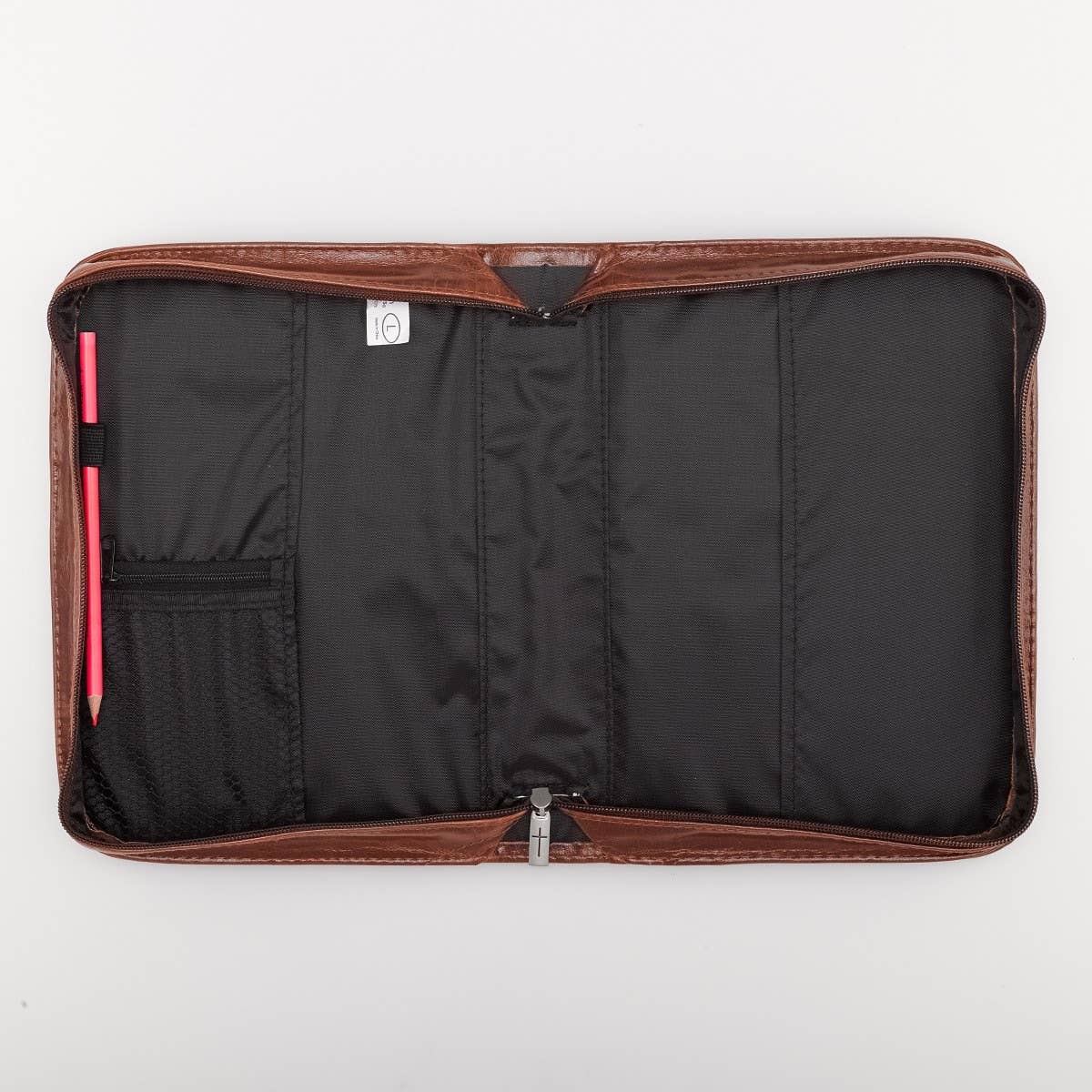 Interior of Faith honey brown faux leather Bible cover showing open case with pen loops, zippered mesh pocket, and protective lining for organizing Christian Bible and accessories