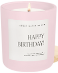 Happy Birthday candle in pink jar with Tahitian vanilla and buttercream scent on white background