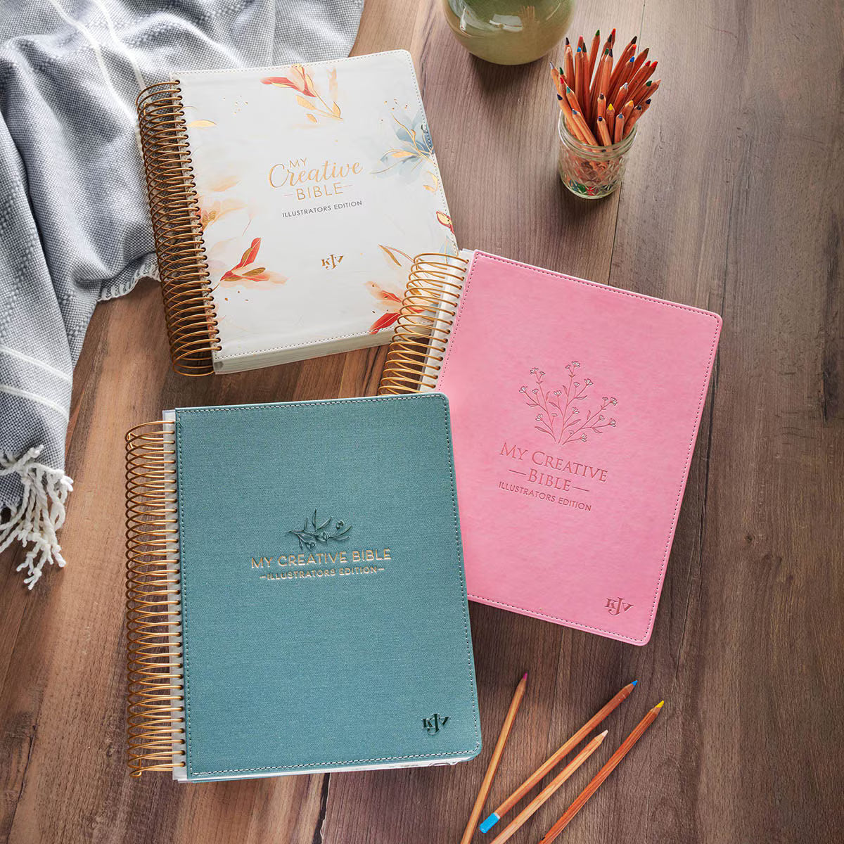 My Creative Bible Spiral Bound Illustrators Edition KJV in pearlized white, teal, and pink cover designs