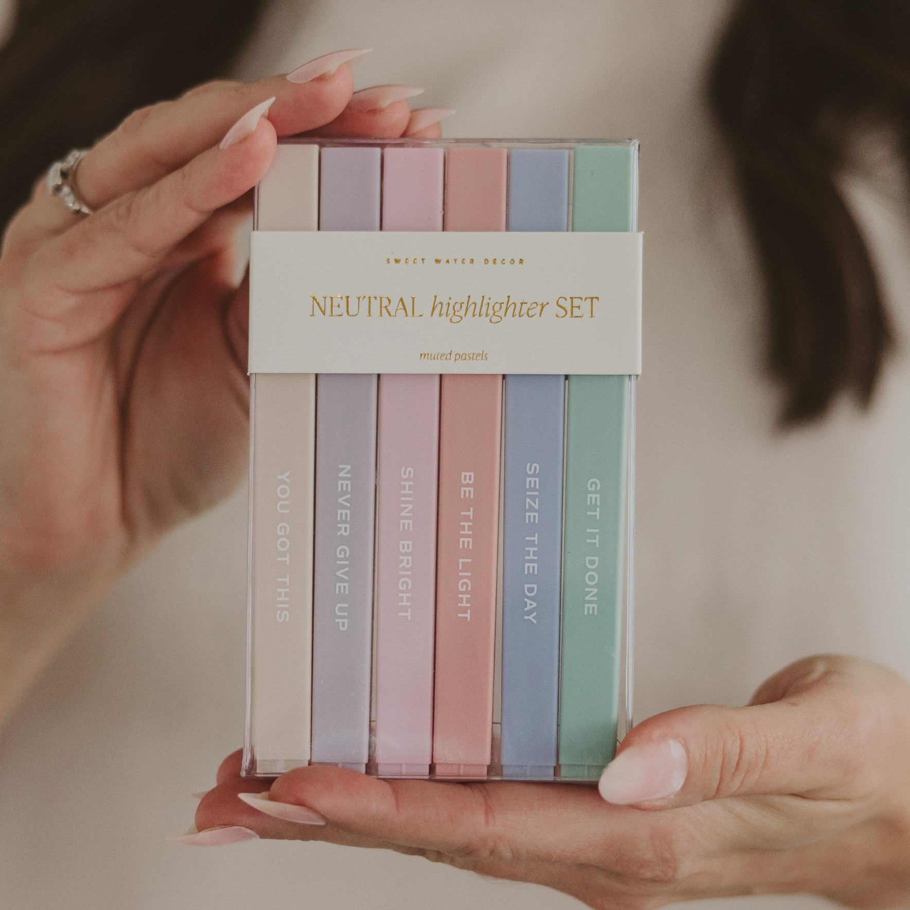 Neutral inspirational highlighter set in clear packaging held in hands showing muted pastel colors perfect for Bible study, journaling, and gift giving