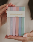 Neutral inspirational highlighter set in clear packaging held in hands showing muted pastel colors perfect for Bible study, journaling, and gift giving