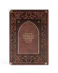 Back cover of Palma Christian notebook featuring brown floral design with gold foil Scripture from Romans 11:36