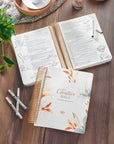 Pearlized White My Creative Bible KJV shown open for note-taking with wide journaling margins and lay-flat spiral binding
