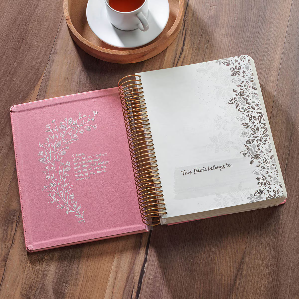 Inside cover of pink Creative Bible KJV Illustrators Edition showing spiral binding and ownership page with Scripture verse