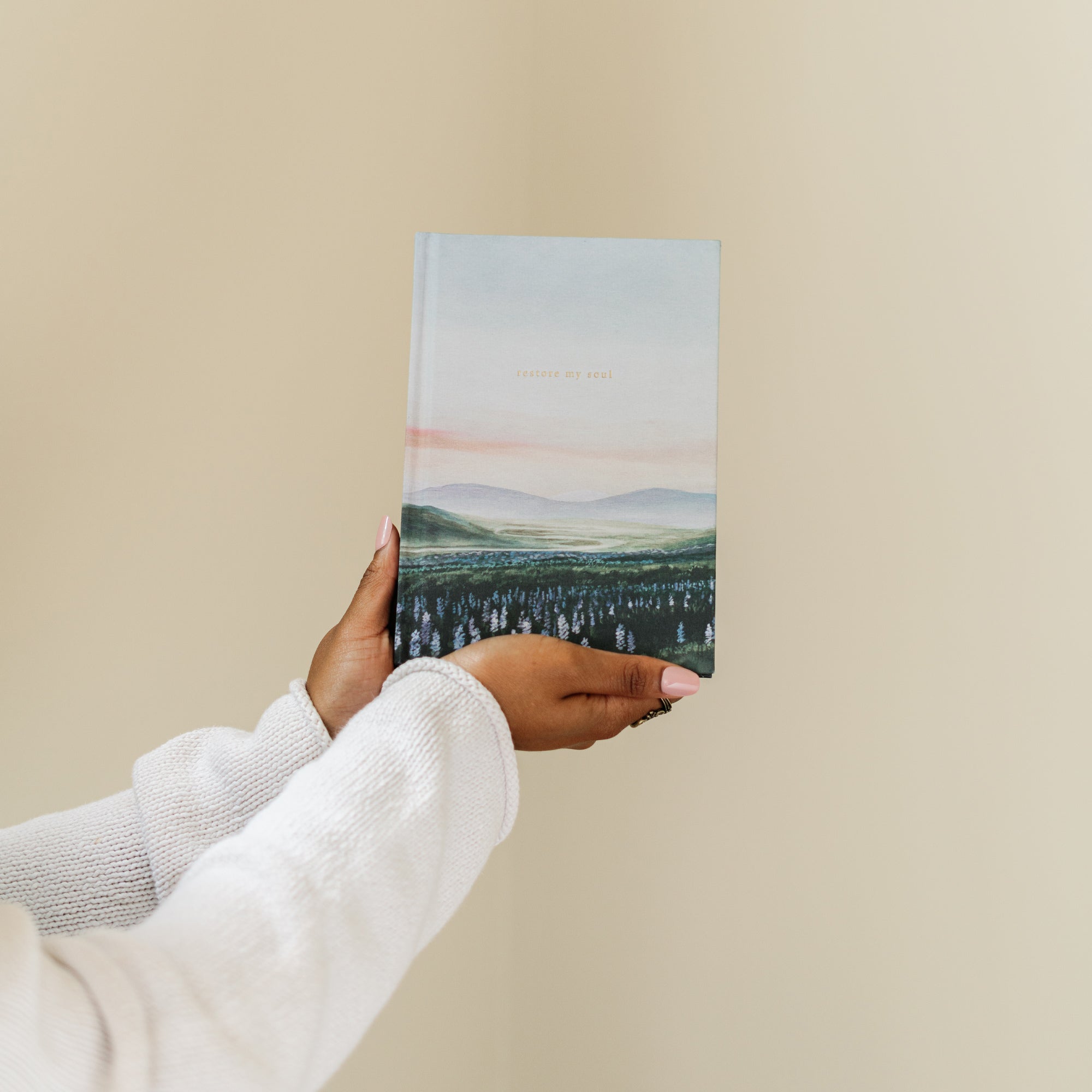 Restore My Soul Iceland Christian prayer journal held in hand showing size and hardcover design