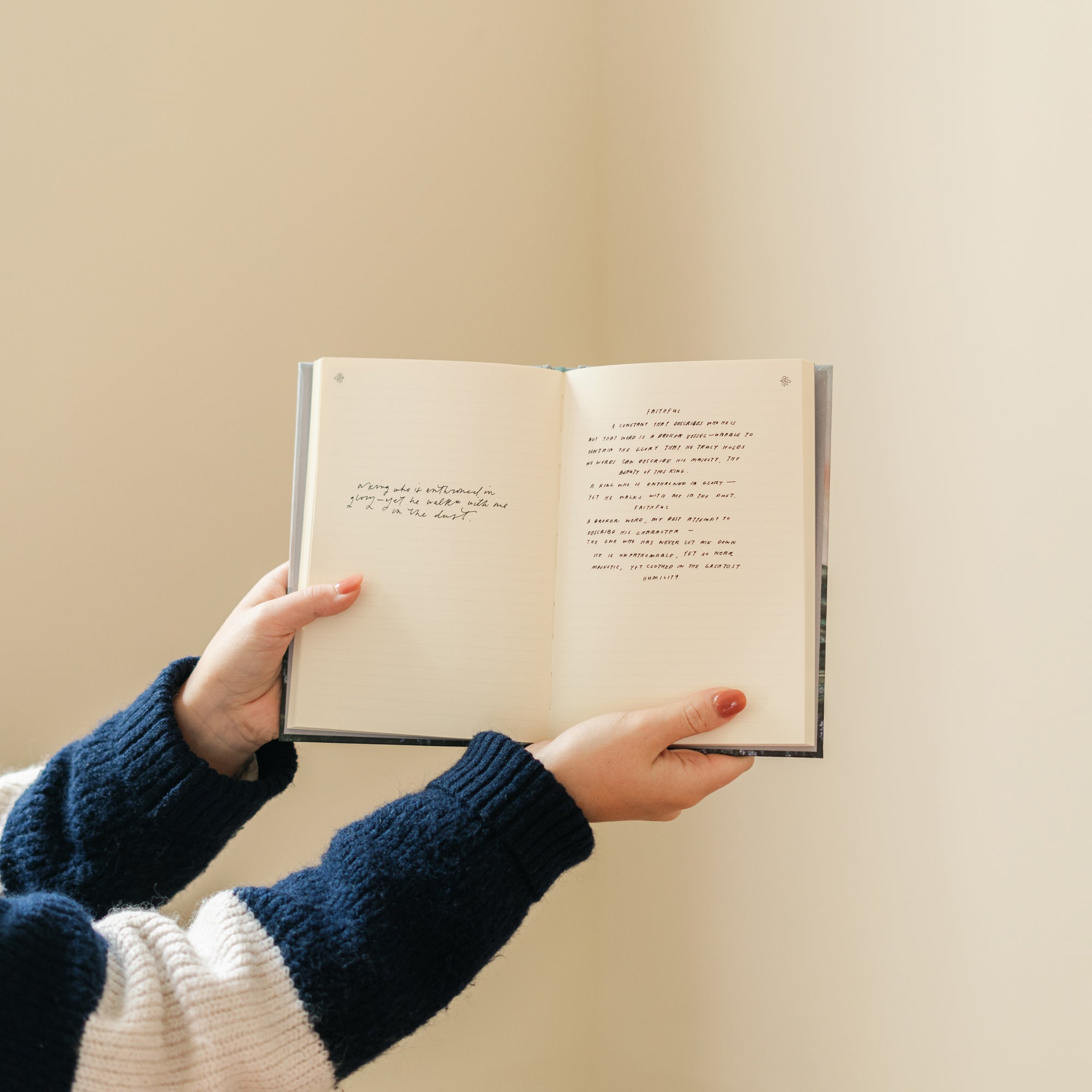 Open pages of Restore My Soul Iceland Christian prayer journal held in hands during journaling